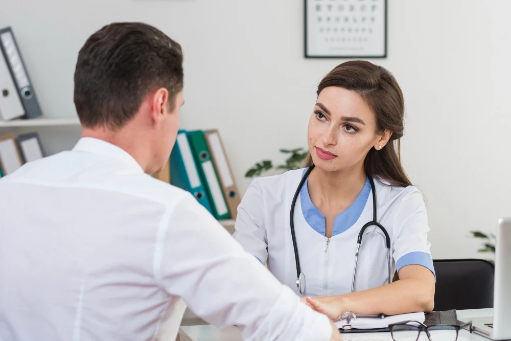 Doctor consulting a patient across a desk